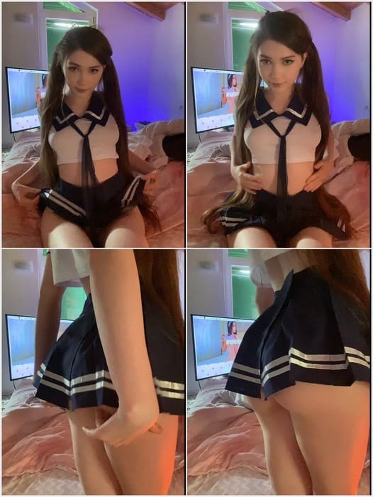 Karina Kozyreva nude in casual streetwear, walks confidently through an urban setting, blending modern style with authenticity.